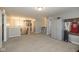 Spacious bonus room features neutral decor and a decorative display cabinet and sports memorabilia for stylish storage at 1773 Winchester Blvd, Avon, IN 46123