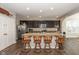 Spacious kitchen featuring dark cabinetry, stainless appliances, granite countertops, and large island with seating at 1773 Winchester Blvd, Avon, IN 46123