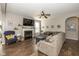 Cozy living room with fireplace, ceiling fan, and hardwood floors at 1773 Winchester Blvd, Avon, IN 46123