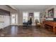 Open living room with hardwood floors, front door, and lots of natural light at 1773 Winchester Blvd, Avon, IN 46123