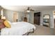 Spacious main bedroom with bed, ceiling fan, dresser, and adjoining bath and closet at 1773 Winchester Blvd, Avon, IN 46123