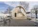 Backyard featuring a large deck with chairs and second story door with stairs at 2349 S Randolph St, Indianapolis, IN 46203