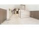 Lofted bedroom featuring neutral carpet and a built-in bookshelf at 2349 S Randolph St, Indianapolis, IN 46203