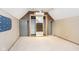 Lofted bedroom featuring neutral carpet and a mirrored closet at 2349 S Randolph St, Indianapolis, IN 46203