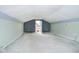 Bright bonus room with vaulted ceiling, carpet flooring, and an exterior door which provides seamless outdoor access at 2349 S Randolph St, Indianapolis, IN 46203