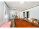 Bright dining area featuring a wood dining table and a large mirrored wall at 2349 S Randolph St, Indianapolis, IN 46203