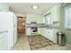 Well-lit kitchen with appliances, countertops, and tiled flooring at 2349 S Randolph St, Indianapolis, IN 46203