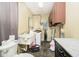 Compact laundry room featuring a sink, washing machine, and wall-mounted cabinets at 2349 S Randolph St, Indianapolis, IN 46203