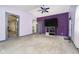 Spacious living room featuring a gray trimmed doorway and a ceiling fan at 2349 S Randolph St, Indianapolis, IN 46203