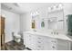 Modern bathroom featuring double sinks, ample cabinet space, and contemporary fixtures for convenience at 2408 E Stafford Pl, Martinsville, IN 46151