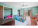 Bright bedroom with hardwood floors, a ceiling fan, sliding glass doors and closet space at 2408 E Stafford Pl, Martinsville, IN 46151