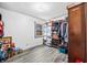 Bedroom featuring laminate floors, one window and large closet area at 2408 E Stafford Pl, Martinsville, IN 46151