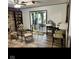 Cozy dining area featuring a sunroom view, breakfast bar, and access to a brick fireplace living room at 2408 E Stafford Pl, Martinsville, IN 46151