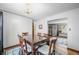 Classic dining room with wood table, decorative chandelier, and blue rug for a cozy Gathering gathering at 2408 E Stafford Pl, Martinsville, IN 46151
