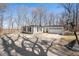 Spacious driveway leading to a charming home with attached garage and basketball hoop at 2408 E Stafford Pl, Martinsville, IN 46151