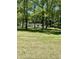 Set back from the road, this property features mature trees and a sprawling lawn at 2408 E Stafford Pl, Martinsville, IN 46151