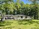 This home has an attached garage, beautiful flowerbeds, and a sprawling lawn at 2408 E Stafford Pl, Martinsville, IN 46151