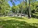This charming home with mature trees, has a sprawling yard, and is set back from the road at 2408 E Stafford Pl, Martinsville, IN 46151