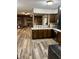 Kitchen area showcasing custom cabinetry, stainless appliances, and an open view to the living room at 2408 E Stafford Pl, Martinsville, IN 46151