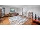 Comfortable living room with a cozy sofa, hardwood floors, and a welcoming atmosphere at 2408 E Stafford Pl, Martinsville, IN 46151
