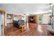 Spacious living room with hardwood floors, fireplace, and comfortable black leather seating at 2408 E Stafford Pl, Martinsville, IN 46151