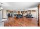 Bright living room featuring hardwood floors, comfortable seating, and sliding door access at 2408 E Stafford Pl, Martinsville, IN 46151