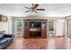 Open living area with large TV and hardwood floors at 2408 E Stafford Pl, Martinsville, IN 46151