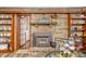 Living room fireplace with a mantel and built-in shelves on either side at 2408 E Stafford Pl, Martinsville, IN 46151