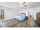 Comfortable main bedroom with wood bed frame, a ceiling fan, and natural light, designed for relaxation at 2408 E Stafford Pl, Martinsville, IN 46151