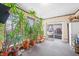 Sunroom with brick walls, lots of windows and plants at 2408 E Stafford Pl, Martinsville, IN 46151