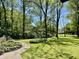 This home has garden beds, mature trees and a sprawling lawn at 2408 E Stafford Pl, Martinsville, IN 46151