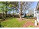 Large tree in backyard with a swing and garden area at 245 Suncrest Dr, Greenwood, IN 46143