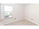 Empty bedroom featuring natural light from windows and neutral colored walls with standard electric outlets at 245 Suncrest Dr, Greenwood, IN 46143