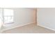 Bedroom features carpeted floors, neutral walls, a window and a doorway for natural light and easy access at 245 Suncrest Dr, Greenwood, IN 46143