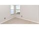 Empty carpeted bedroom featuring natural light from windows and neutral colored walls with standard electric outlets at 245 Suncrest Dr, Greenwood, IN 46143