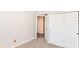 Bedroom featuring neutral walls, carpet, and a closet with double doors, creating a simple and inviting space at 245 Suncrest Dr, Greenwood, IN 46143