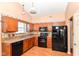 Efficient kitchen with black appliances and plenty of cabinet space for storage and meal prep at 245 Suncrest Dr, Greenwood, IN 46143