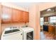 Convenient laundry area with modern washer and dryer, adjacent to the kitchen for added functionality at 245 Suncrest Dr, Greenwood, IN 46143