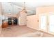 Open-concept living space flows seamlessly into the kitchen, featuring natural light and ample room at 245 Suncrest Dr, Greenwood, IN 46143