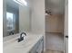 Bright bathroom featuring a large mirror, sleek vanity, and modern fixtures with a bedroom view at 2617 N Temple Ave, Indianapolis, IN 46218
