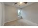 Bright bedroom featuring neutral paint, a ceiling fan, carpeted floor and a window at 2617 N Temple Ave, Indianapolis, IN 46218