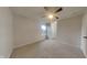 Cozy bedroom with neutral carpet, a ceiling fan, a window, and a closet at 2617 N Temple Ave, Indianapolis, IN 46218