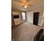 Bright bedroom with closet, ceiling fan, shelving unit, and lots of open floor space at 298 Rocky Rd, Greenfield, IN 46140