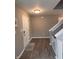 Inviting foyer featuring wood floors, fresh paint, and staircase access to the upper level at 298 Rocky Rd, Greenfield, IN 46140