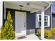 Welcoming entrance featuring a bright door, manicured shrubs, and a security camera above at 298 Rocky Rd, Greenfield, IN 46140