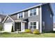 View of the home showcasing its well-maintained lawn and inviting front entrance at 298 Rocky Rd, Greenfield, IN 46140