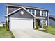 Classic home with a two-car garage, tidy landscaping, and a well-kept lawn at 298 Rocky Rd, Greenfield, IN 46140