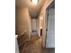 Upstairs hallway with carpet and entryways to various bedrooms and bathrooms at 298 Rocky Rd, Greenfield, IN 46140