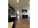 Modern kitchen featuring stainless steel appliances, dark cabinets and a view of the backyard at 298 Rocky Rd, Greenfield, IN 46140
