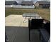 Concrete patio with a glass table and seating ready for outdoor enjoyment and relaxation at 298 Rocky Rd, Greenfield, IN 46140
